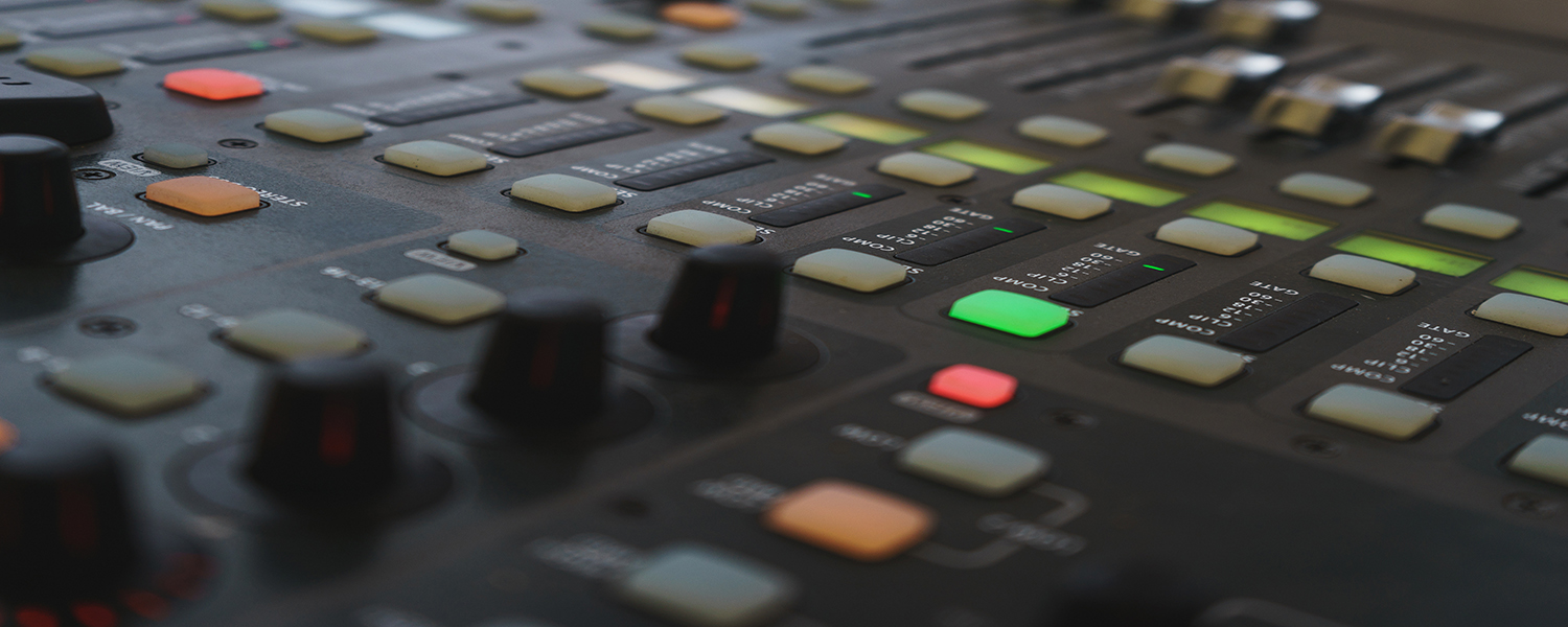 Music equipment closeup. Management console sound design at the event. Big black mixer with control knobs.